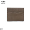 Porte-cartes en cuir véritable marron avec surface texturée et légères gravures.