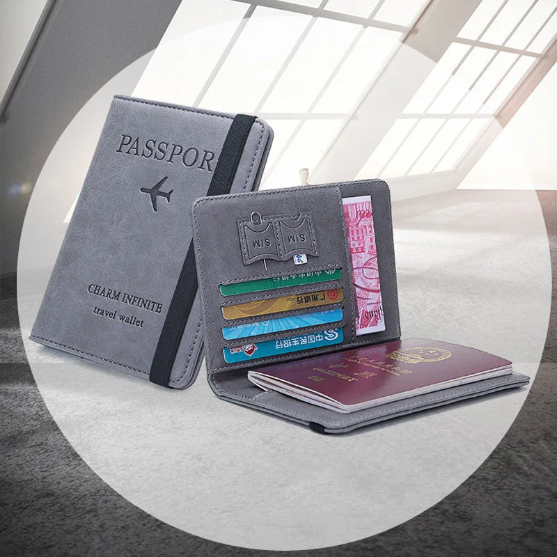 A gray PU leather passport holder with various slots and a passport wallet is displayed on a light surface.