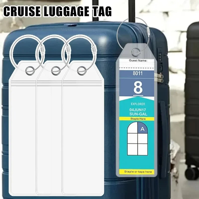 A blank cruise luggage tag is displayed attached to a blue rolling suitcase with a steel ring.