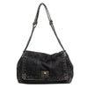 A dark denim tote bag with a chain strap.