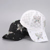 White mesh snapback baseball cap decorated with silver floral embellishments