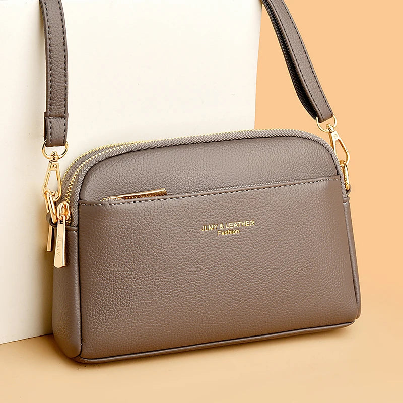 A brown PU leather trendy shoulder crossbody bag with gold hardware shown against a light background.