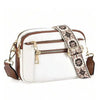 A white and brown patterned PU leather crossbody bag with gold hardware.