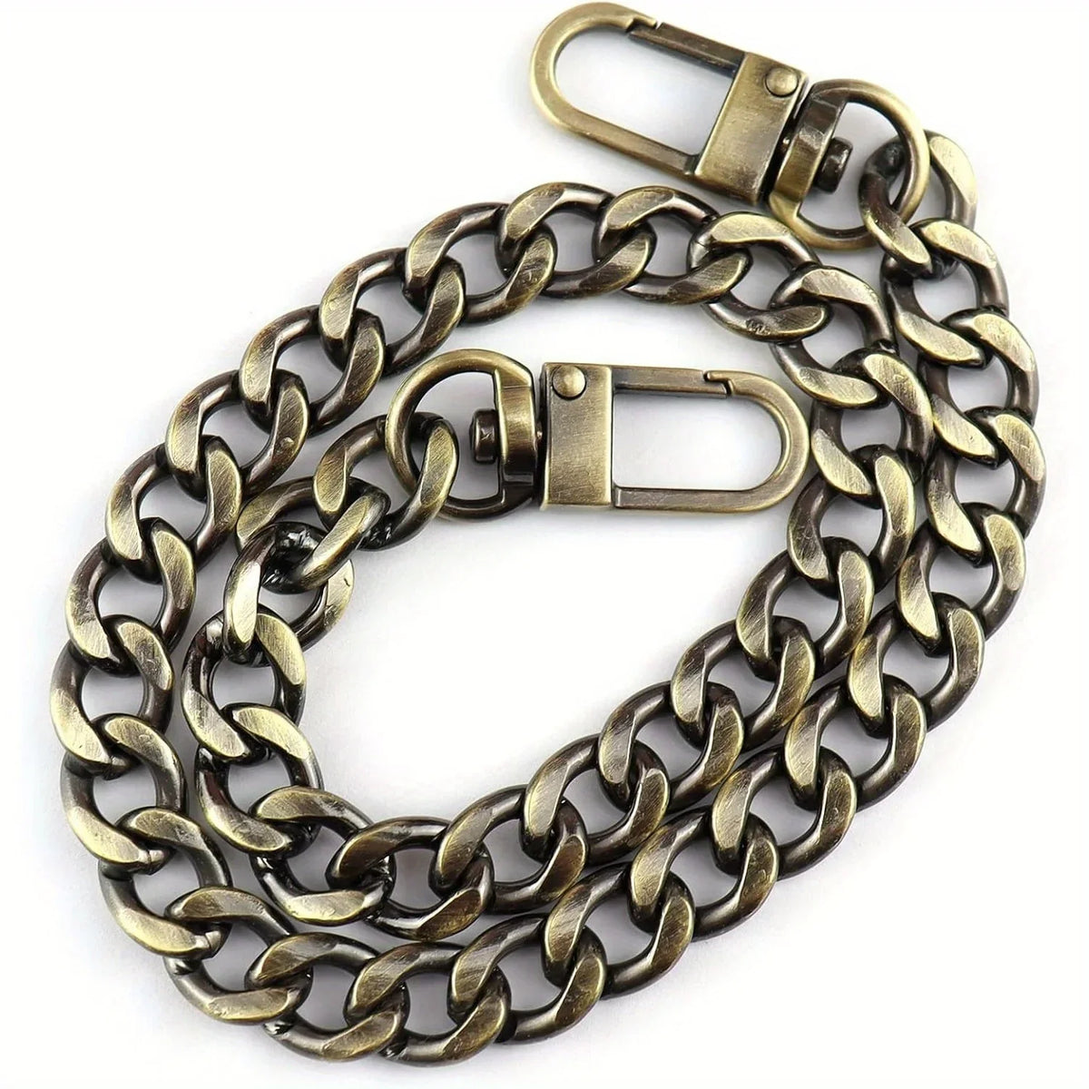 A close-up view of a brass metal chain strap used for handbags and wallets.