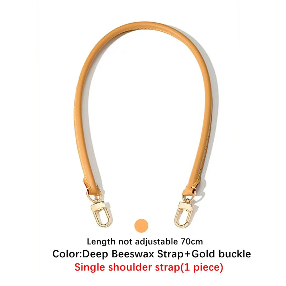 A single tan leather shoulder strap with a gold buckle shown against a white background.