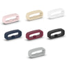 A set of five silicone watch strap retainer rings in various colors including pink, beige, white, dark blue, and black.