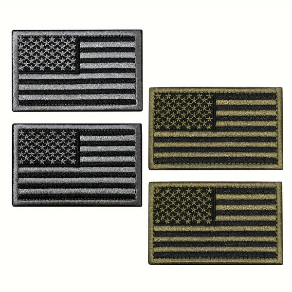 Drei bestickte Patches mit amerikanischem Flaggen-Design in verschiedenen Graustufen und Goldtönen.