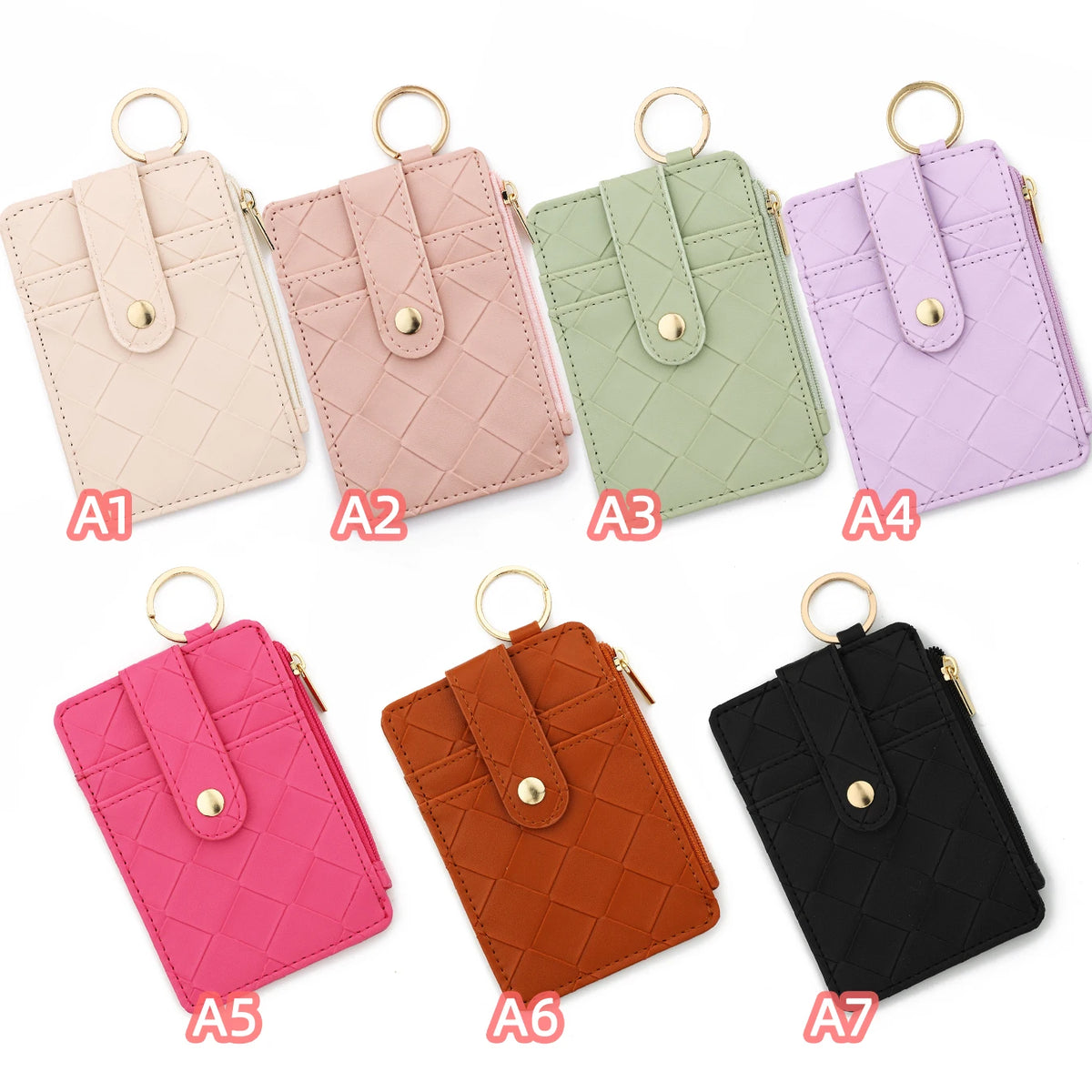 A set of seven pastel colored PU leather card holder wallets with gold rings and tassels