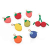 A collection of red and green fruit-shaped coin purse keychains featuring cherry, strawberry, and lime designs.