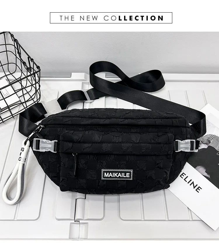 Black plaid crossbody chest bag with adjustable strap displayed on a white surface.