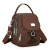 Sac bandoulière floral marron et durable avec fermeture éclair et sangle en cuir.