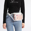 A woman wearing a pink clear waterproof fanny pack and light wash jeans, with the word Love printed on her black long-sleeved