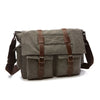 A dark gray canvas messenger bag for men with brown leather accents.