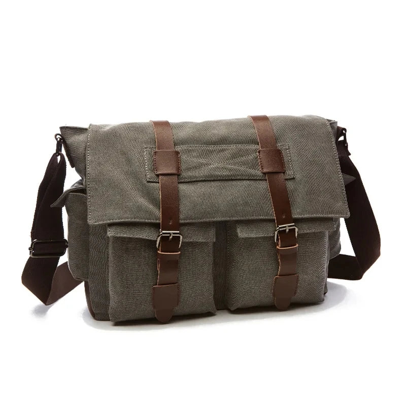 A dark gray canvas messenger bag for men with brown leather accents.