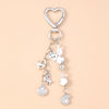 Silver starfish keychain with pearl accents and a heart charm