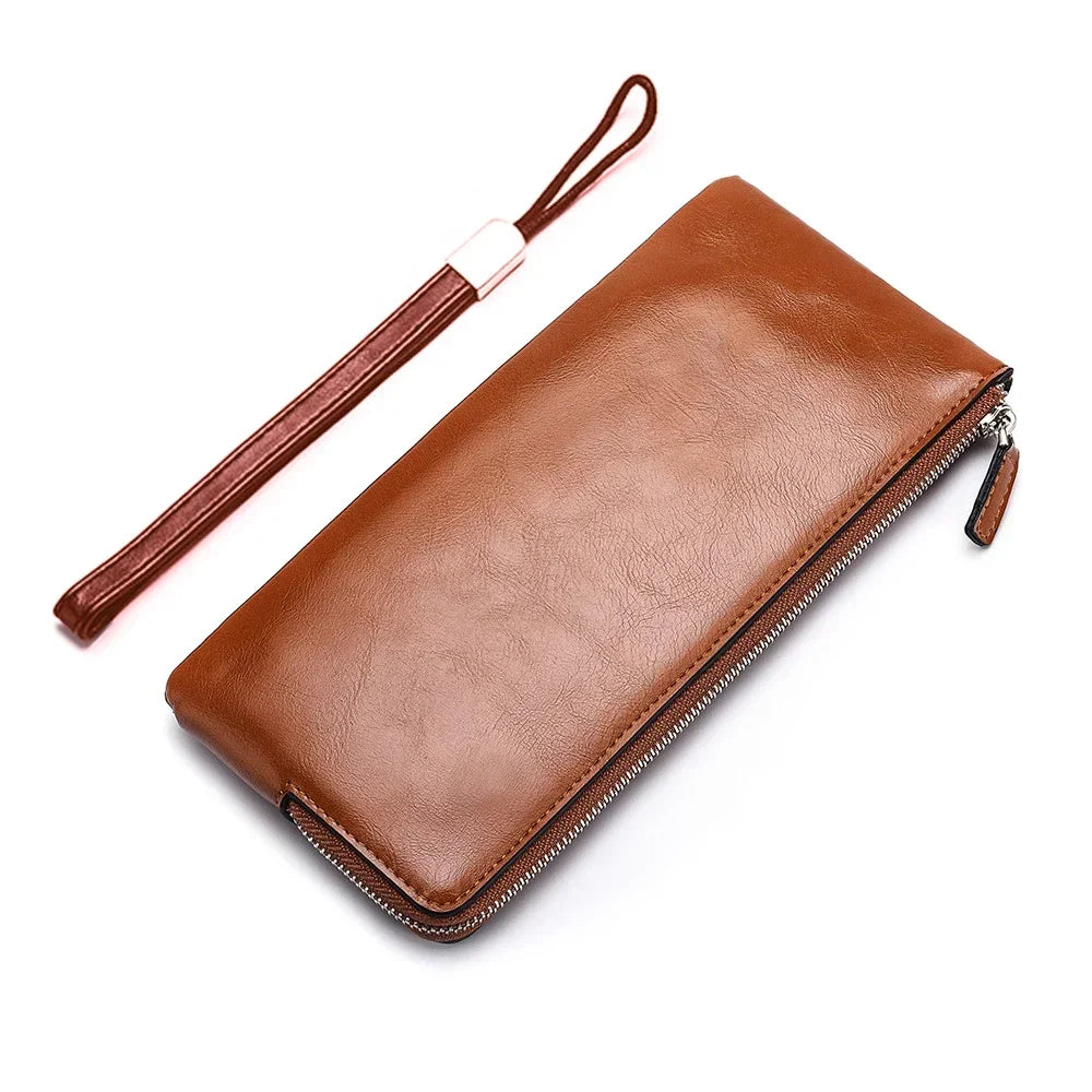 A brown PU leather men's clutch wallet with a leather strap and zipper visible on a white background.