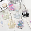 A collection of clear and colored acrylic photo card holders with angel wings and charms.