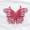A pink rhinestone butterfly applique sticker with detailed wings and antennae.