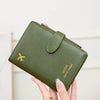 A close-up of a multi-functional PU leather passport wallet in olive green color, showing various passport and card slots.
