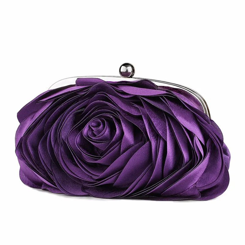 A deep purple rose floral evening clutch bag with a silver chain strap.