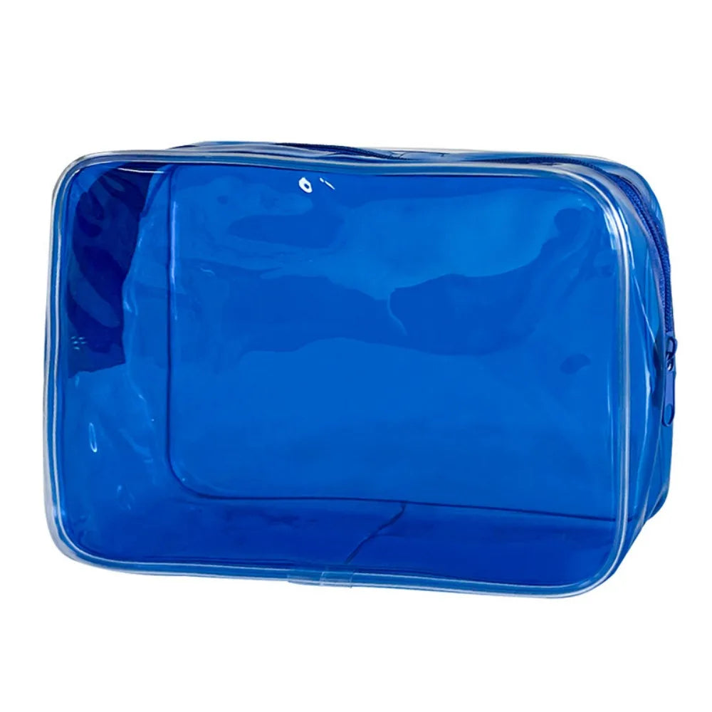 A transparent blue PVC travel makeup bag with a zipper closure.