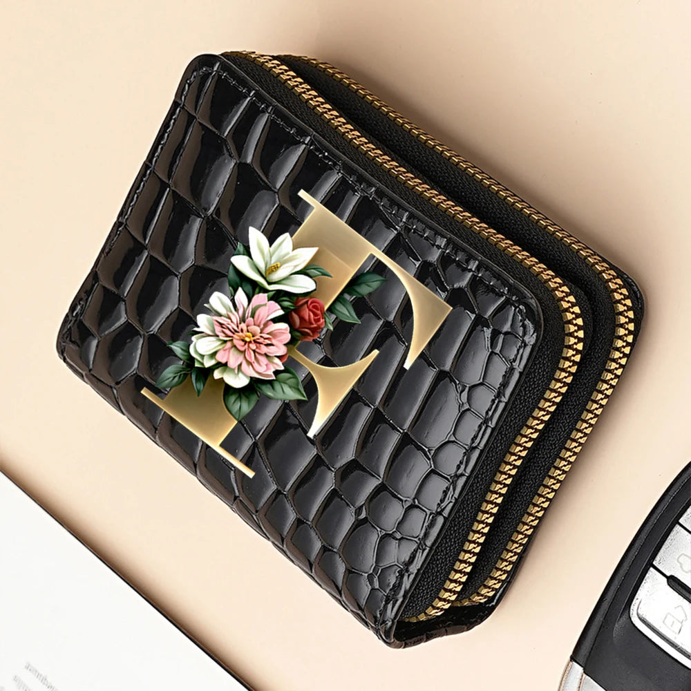 Black PU leather double-zip clutch wallet featuring a gold geometric design and floral print.