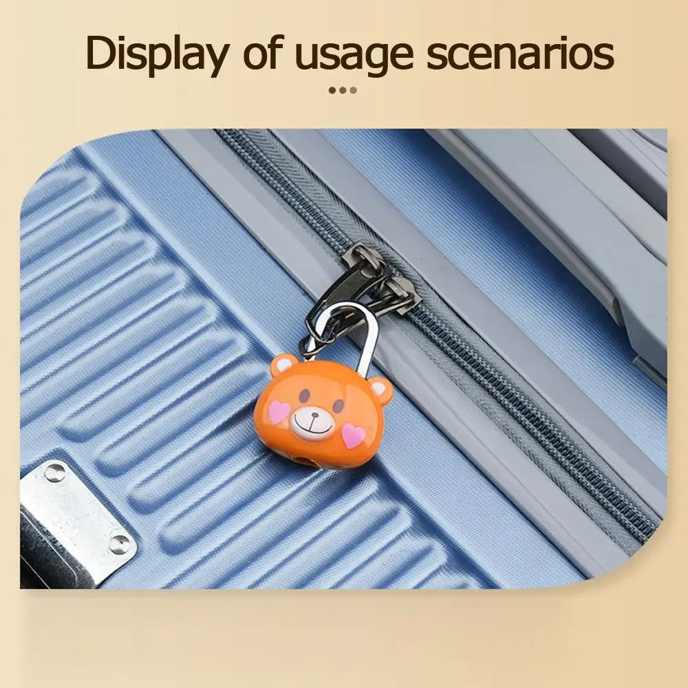An orange bear-shaped combination padlock is shown attached to a silver zipper on a blue fabric.