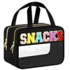 Black clear makeup bag with a gold zipper and colorful chenille letters spelling SNACKS