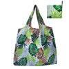 A reusable tote bag featuring a vibrant tropical leaf pattern in shades of green and brown on a white background.