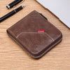 A brown men's PU waxed oil leather bifold wallet resting on a wooden surface next to a pen.