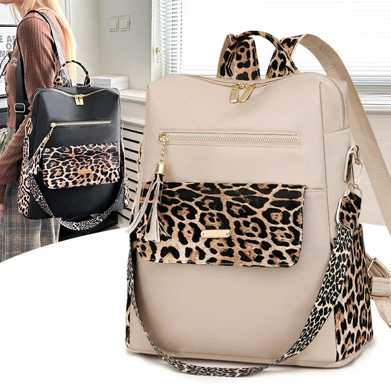 A beige fashion backpack with leopard print accents and gold hardware is shown against a white background.