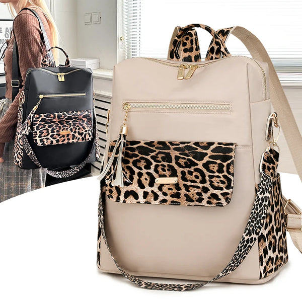 A beige fashion backpack with leopard print accents and gold hardware is shown against a white background.