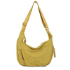 A mustard yellow soft nylon crossbody shoulder bag with adjustable straps.