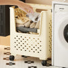 A light beige foldable laundry basket with a perforated design is shown filled with folded gray and beige towels.