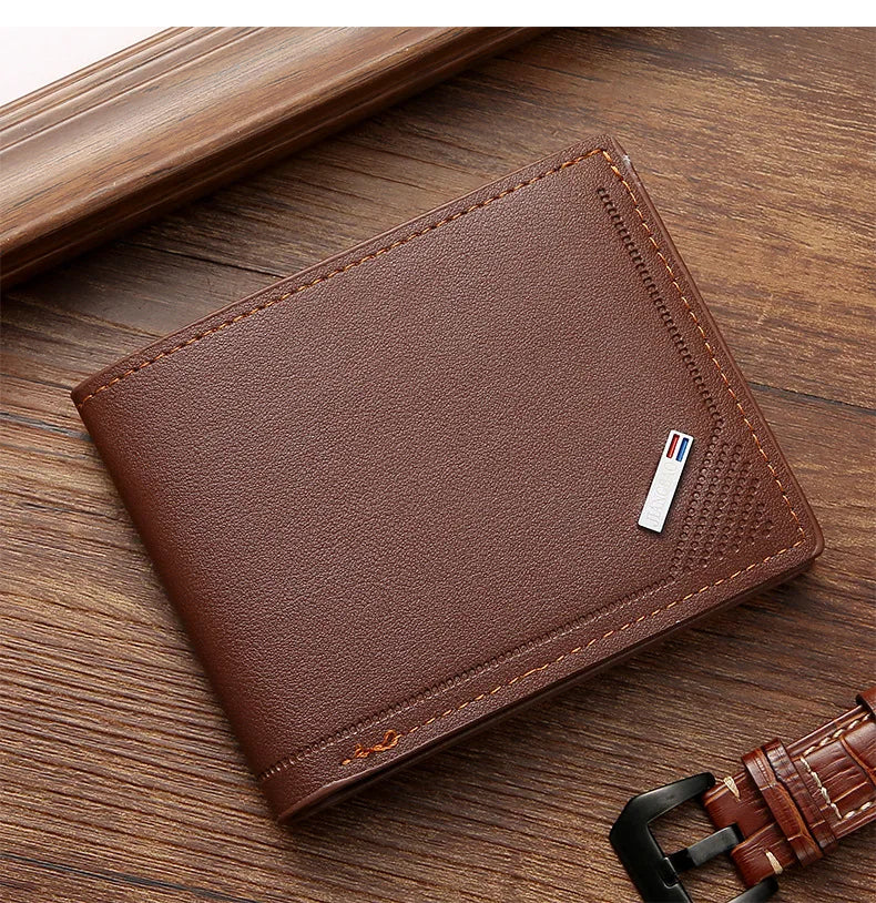 A brown leather wallet with a money clip is shown resting on a wooden surface.