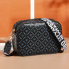 Black fashion crossbody shoulder bag with white text pattern on the fabric