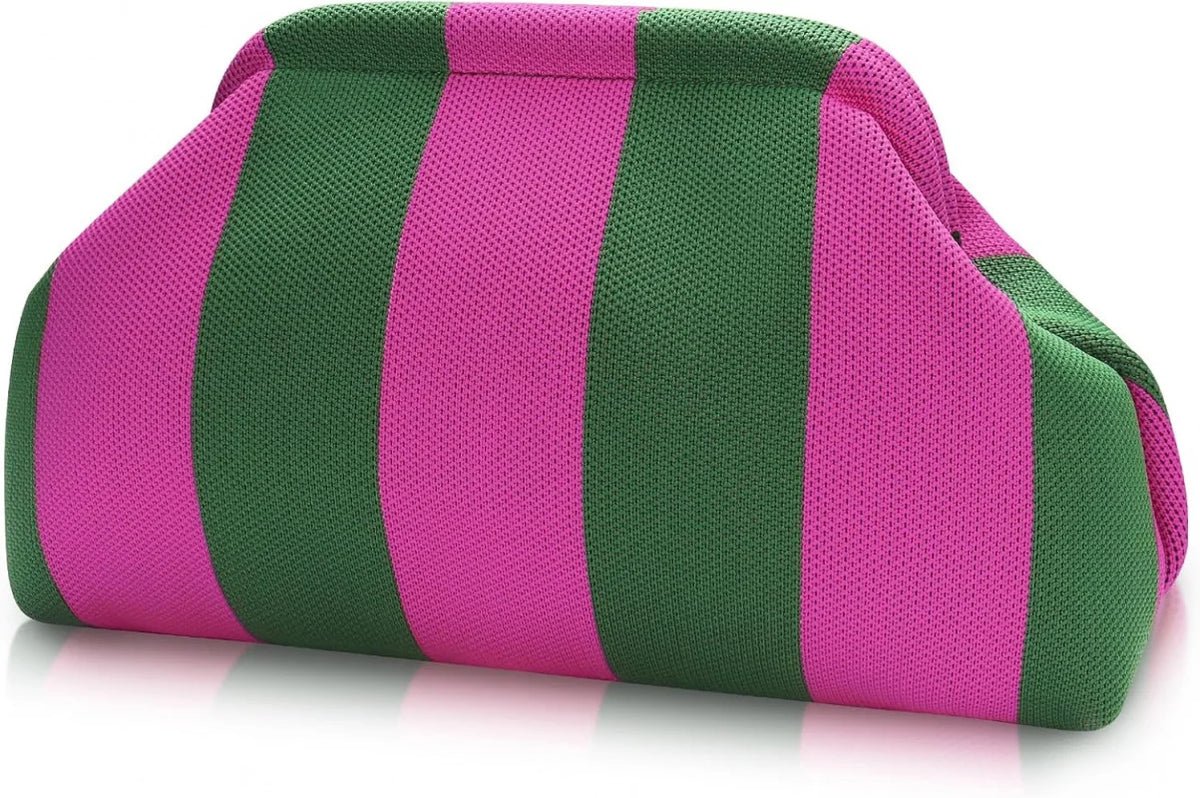 A pink and green striped knit clutch bag lying on a white surface.