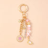 Gold seashell starfish keychain with pink and white pearl accents