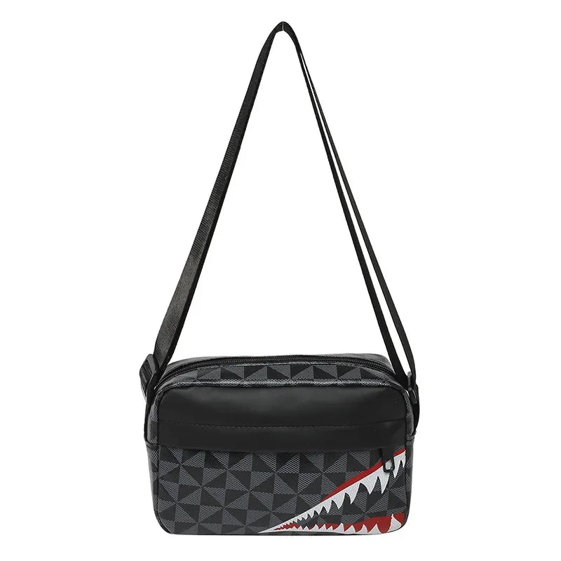 Black crossbody coin purse and mobile phone bag with a geometric pattern and a red and white shark tooth design