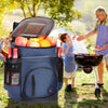 A blue insulated thermal cooler backpack is open, revealing fresh fruit, being used outdoors for a picnic.