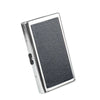 A silver metal cigarette case holder with a textured black surface.