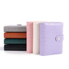 A set of four A7 crocodile ring binder notebooks in shades of gray, orange, green, and lavender.