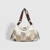 A beige and pink floral patchwork shoulder bag with brown leather straps.