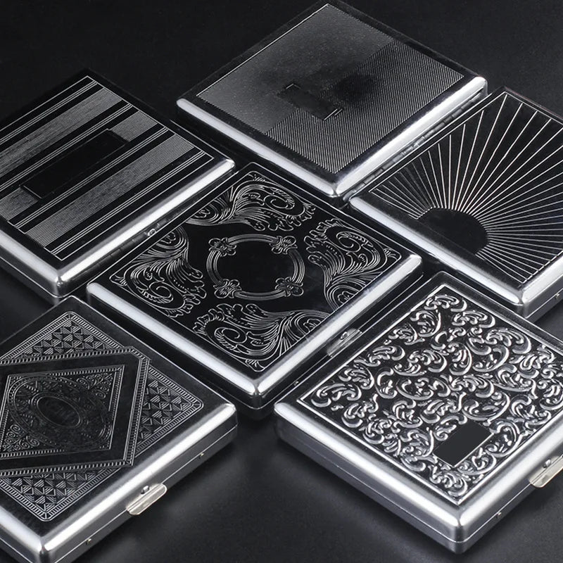A collection of decorative metal cigarette storage boxes with intricate patterns and radiating designs.