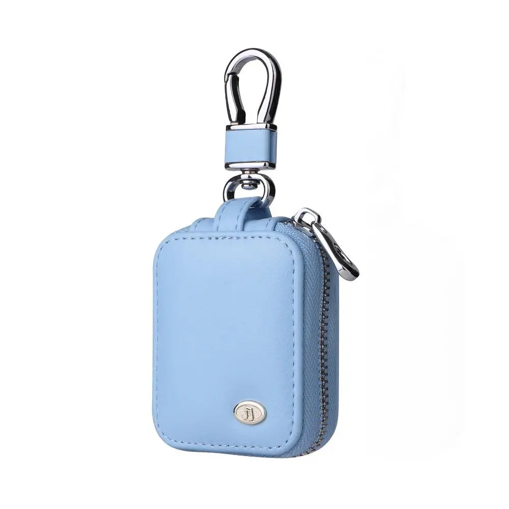 Light blue leather protective case with a silver clasp and keyring for earphones