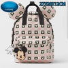 Mochila de peluche con diseño de Mickey Mouse a cuadros rosa y blanco.