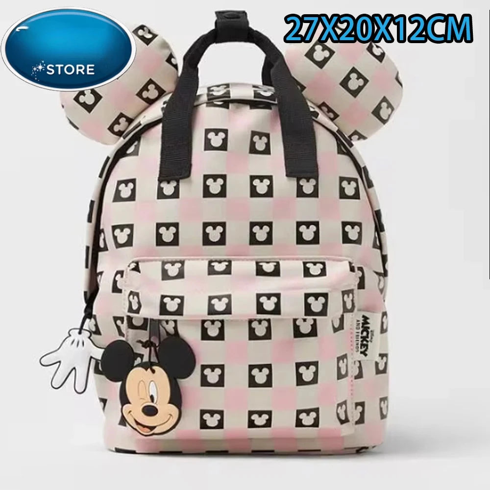Mochila de peluche con diseño de Mickey Mouse a cuadros rosa y blanco.