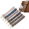 A collection of patterned textile replacement bag straps in various colors and styles, including brown leather and fabric.