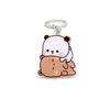 A cute cartoon bear charm made of resin with a silver keyring.