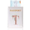 A pink leather passport holder featuring a gold serif letter T design and an ID card.